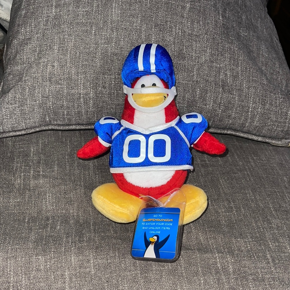 PRICE DROP!!!  Club Penguin Series 2 American Football Player w/used coin Plush